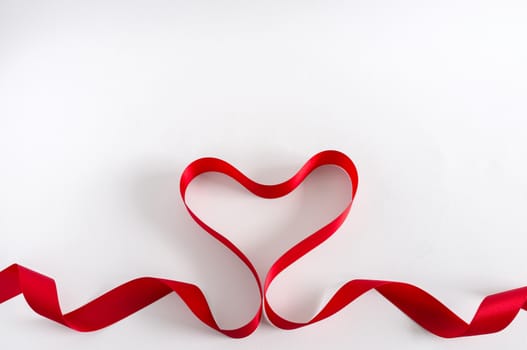 Valentine Heart. Red satin Ribbon. Isolated on white. Border design.