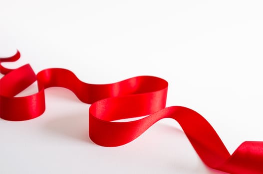 Red satin ribbon isolated on white background