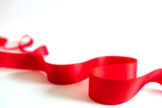 Red satin ribbon isolated on white background
