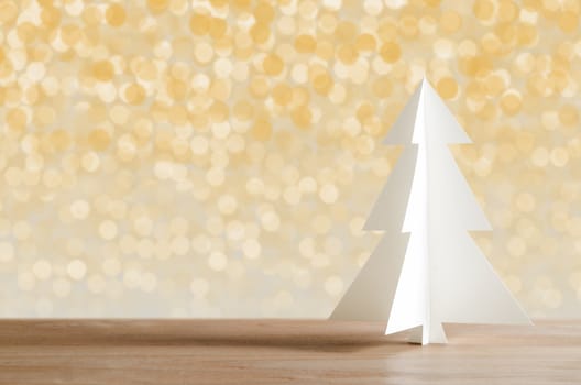Christmas tree with lights snow winter background. Christmas tree paper craft. 
