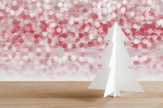 Christmas tree with lights snow winter background. Christmas tree paper craft. 