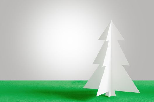 Christmas tree on velvet background. Christmas tree paper craft.
