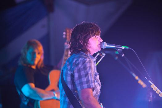 HOT SPRINGS, NC - AUGUST 10: Indigo Girls member Amy Ray sings on stage during a night time show at the Wild Goose Festival on August 10, 2013 in Hot Springs, NC, USA