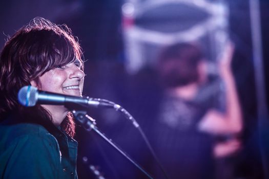 HOT SPRINGS, NC - JULY 9: Singer Amy Ray of the Indigo Girls band smiles while performing on stage at Wild Goose Festival on July 9, 2016 in Hot Springs, NC, USA.