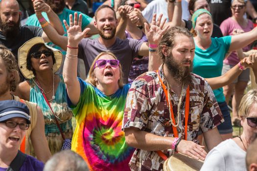 HOT SPRINGS, NC - JULY 10: Overjoyed crowd during worship service at the Wild Goose Festival on July 10, 2016 in Hot Springs, NC, USA.