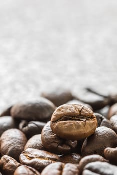 Close up heap of roasted brown coffee beans