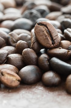 Close up heap of roasted brown coffee beans