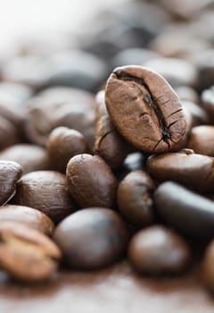 Close up heap of roasted brown coffee beans