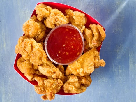 close up of rustic golden fried popcorn chicken nugget