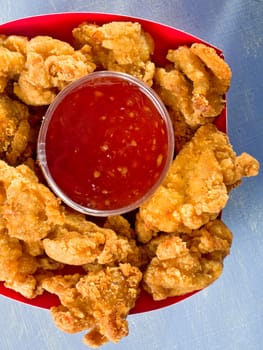 close up of rustic golden fried popcorn chicken nugget