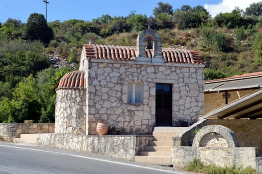 A small white chapel with a bell.