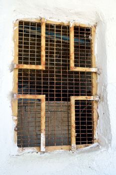 Railing of window in the shape of iron cross.