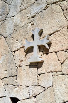 Concrete cross on in roof with a sunset and a blue sky