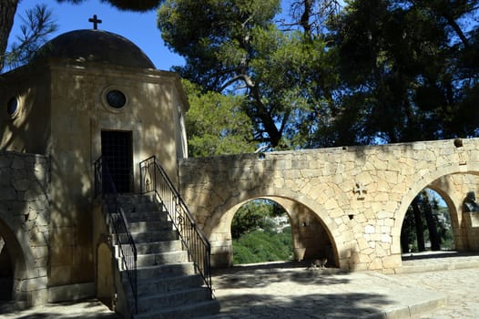 A small white chapel with a bell.