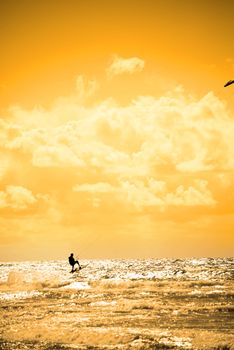 extreme kite surfer jumping waves at beach in ballybunion county kerry ireland on the wild atlantic way