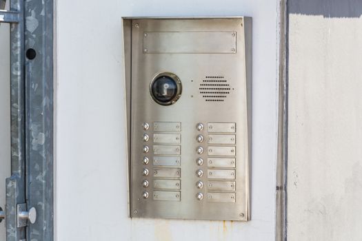 House intercom with doorbells and security camera.