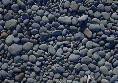 pebbles on a beach background texture wallpaper                               