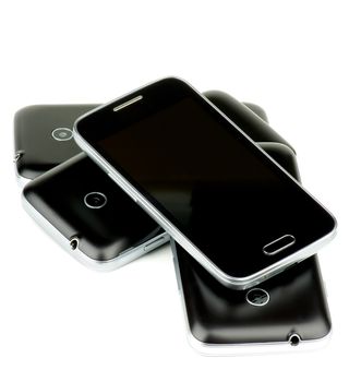 Corner Stack of Black Smartphones with Silver Details and Buttons isolated on white background