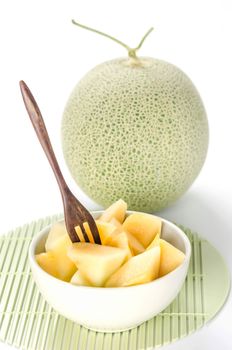 freshly cut cantaloupe melon on white background