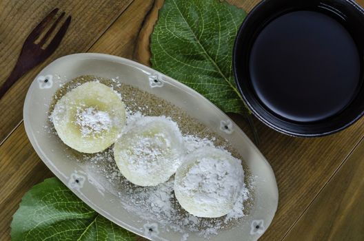 Daifuku Mochi Japanese dessert on dish over wooden background