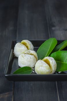 Daifuku Mochi Japanese dessert on dish over wooden background
