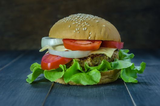 Closeup of home made burgers on wooden background