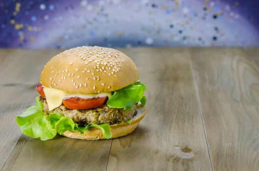 Closeup of home made burgers on wooden background