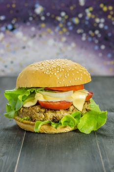 Closeup of home made burgers on wooden background