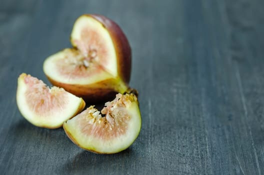 Portion of fresh Figs on wooden background