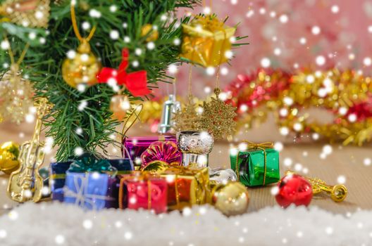 Christmas background with decorations and gift boxes on wooden board