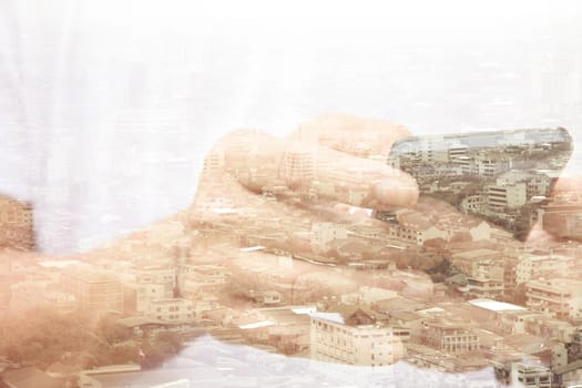 Double exposure of man using smart phone and cityscape background ,Business technology concept.
