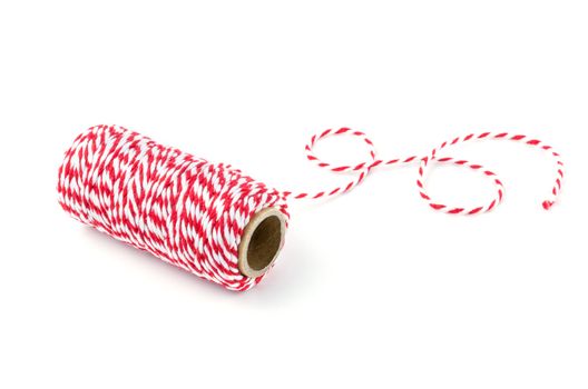 Red and white rope isolated on white background, tied tie multipurpose items seized or sticky material.