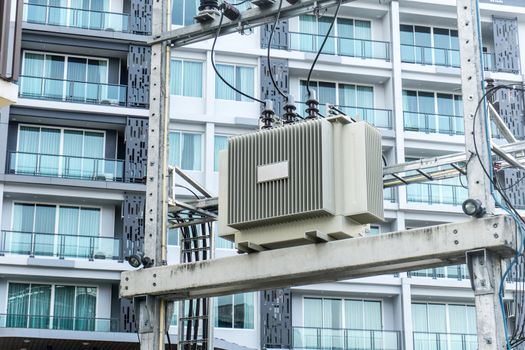 High Voltage Transformers Energy and technology electrical post by the road with power line cables