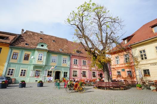 Sighisoara, Romania - October 19th, 2016: Famous view of central square in historic part of Sighisoara, Transylvania region, Romania