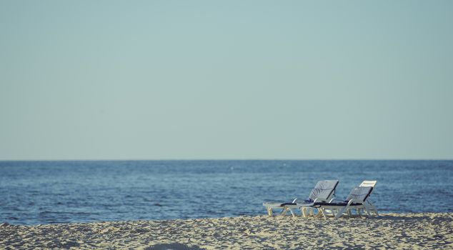 Beach lounger on the beach. Summer time