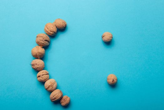 Walnuts, walnuts close-up, walnuts on a blue background