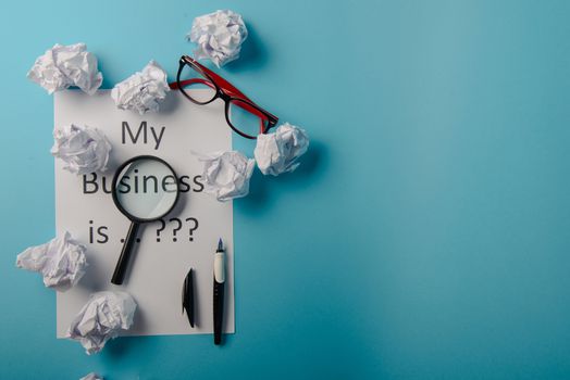 My business is word concept. Business word with business document paper on blue background. For business concept ideas background.