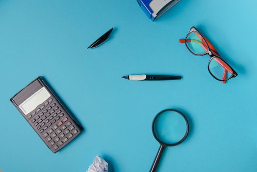 Desk with Tools and Notebook office desk on blue background