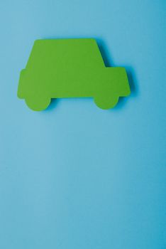 paper green cars figure. top view on blue background