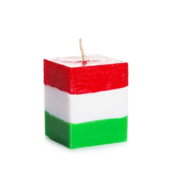 Decorative Handmade candle isolated on white background. Cube-shaped souvenir candle as Hungarian state flag and country symbol. Rectangular cube block shaped candles.