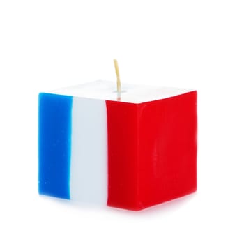 Decorative Handmade candle isolated on white background. Cube-shaped souvenir candle as French state flag and country symbol. Rectangular cube block shaped candles.