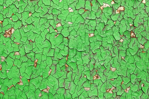 Close-up of peeling paint and rust on a wall
