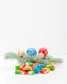 Colorful array of holiday candy in a festive seasonal background.