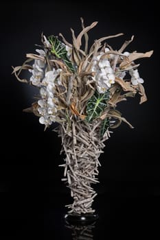 Floristic art composition made of flowers and leaves