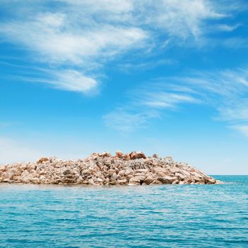 azure sea and the rocky island