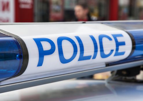 A close-up image of the siren with a sign Police on a policeman vehicle.