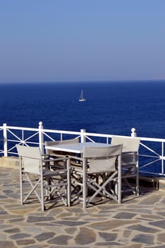 Terrace of white color on the background of ocean on the Mediterranean.