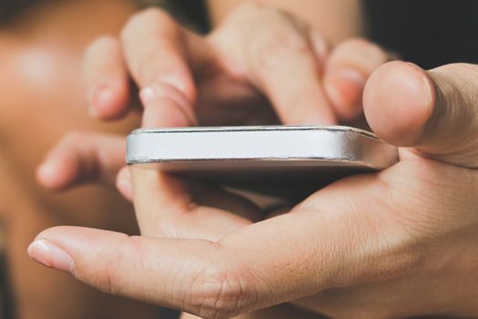 Teenage girl text messaging on her phone