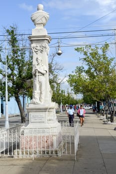 Cienfuegos, Cuba - 18 january 2016: People walking in front of colonial architecture at the old town of Cienfuegos, Cuba