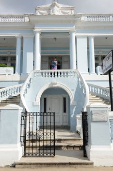 Cienfuegos, Cuba - 18 january 2016: People walking down the stairs of a colonial mansion at the old town of Cienfuegos, Cuba